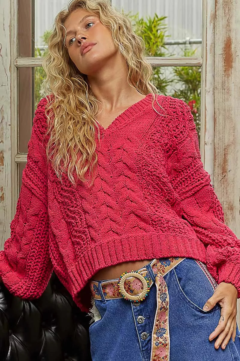 Fuchsia POL Cable-Knit Solid V-Neck Cropped Sweater by Trendsi, featuring a cozy cable-knit design and a stylish V-neck.