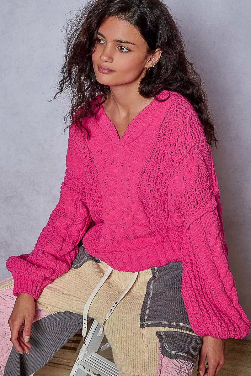 Fuchsia POL Cable-Knit Solid V-Neck Cropped Sweater by Trendsi, showing the close-up of the textured knit fabric and V-neck design.