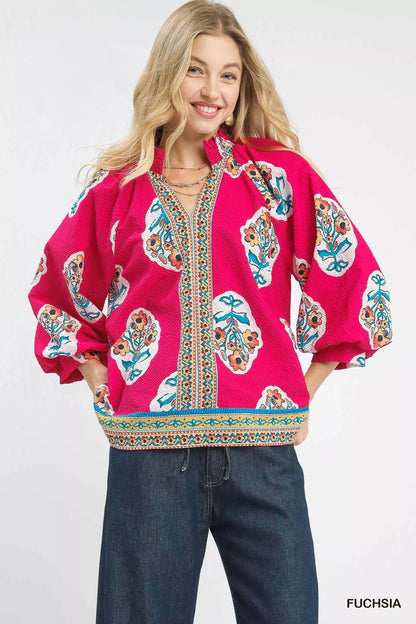 Fuchsia Umgee boho floral print tunic blouse with long sleeves and relaxed fit, featuring vibrant floral patterns.
