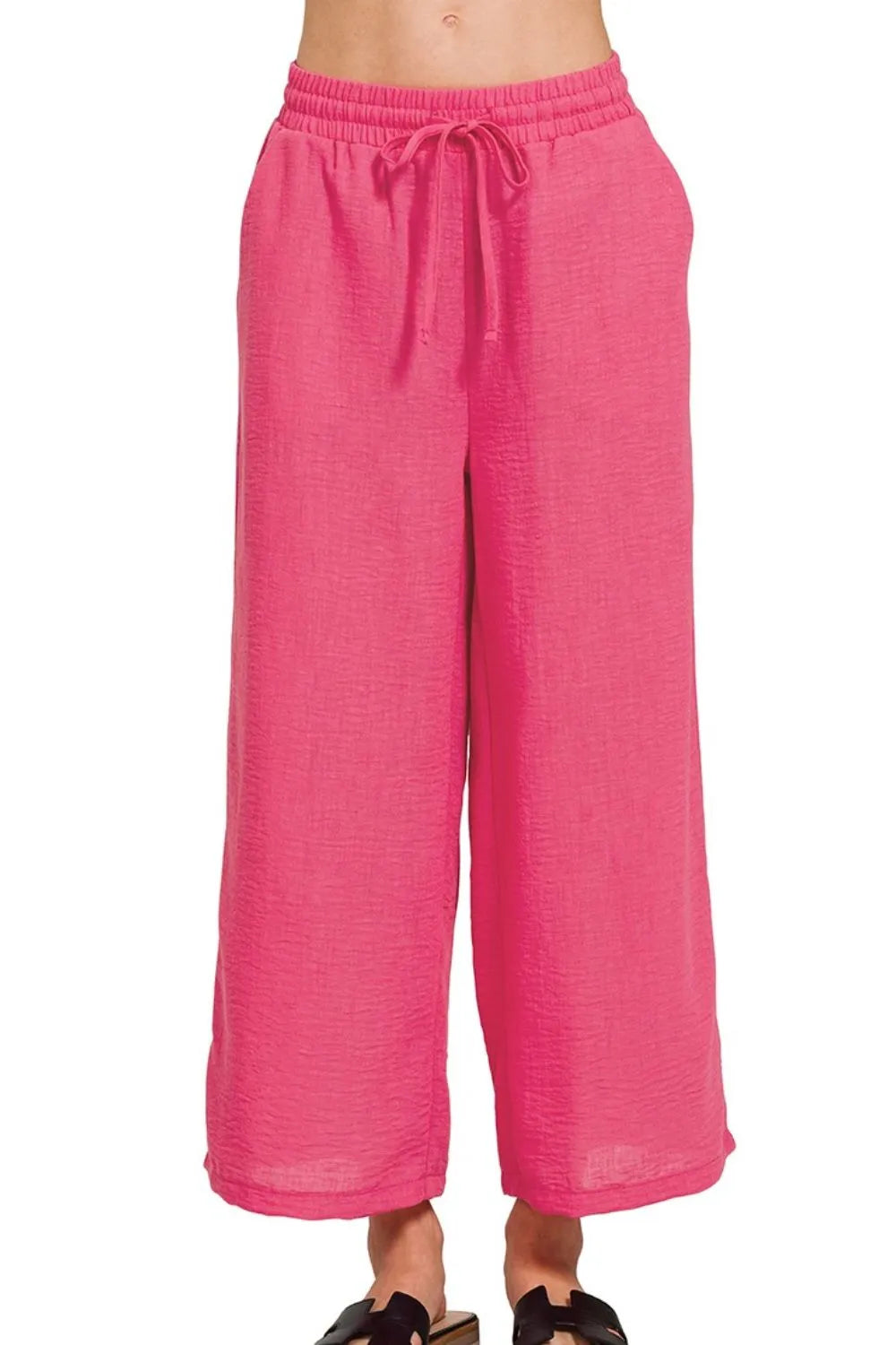 Fuchsia Zenana woven crepe cropped pants with elastic waistband and band waist, styled for a casual, fashionable look.