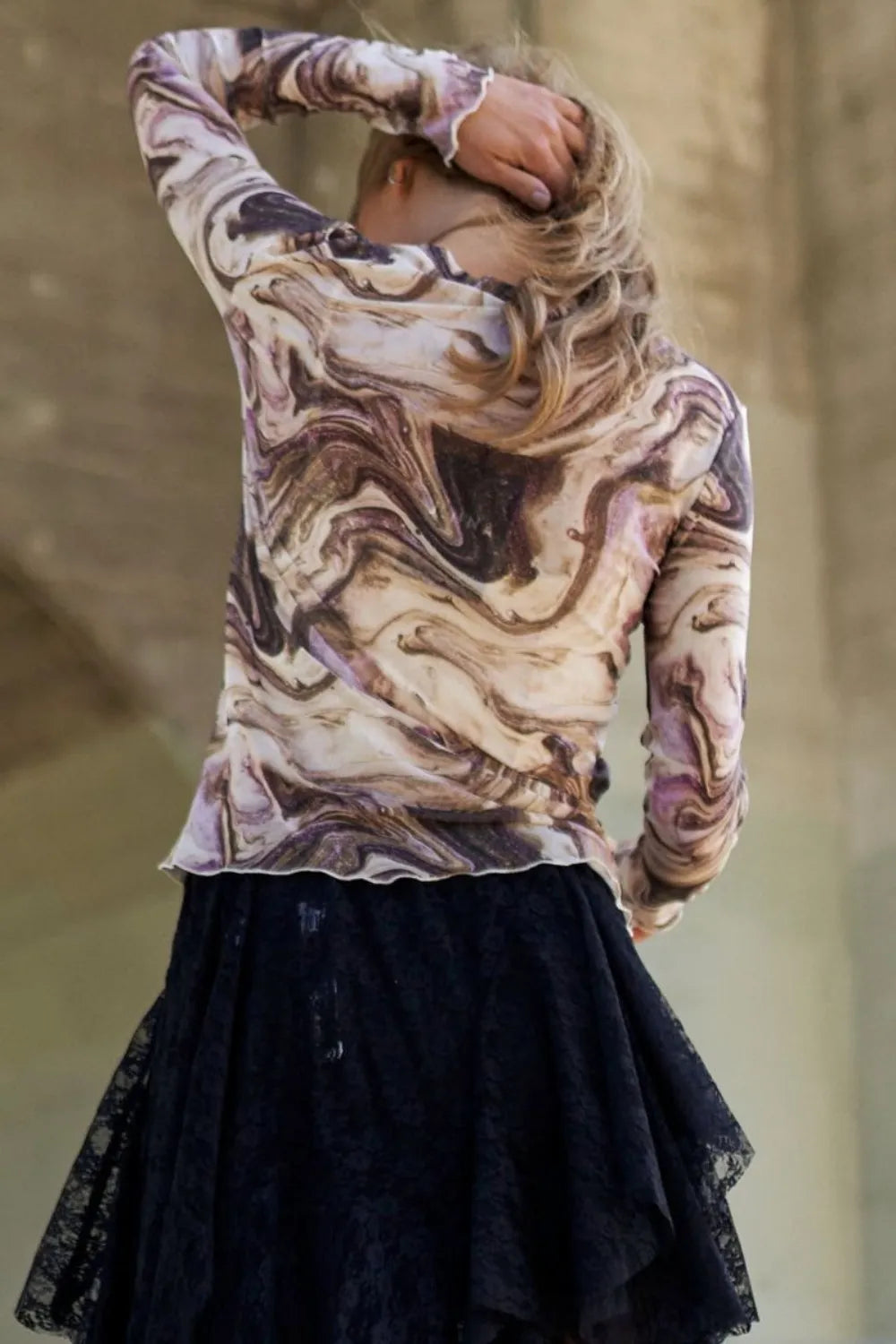 Marble design long sleeve mesh top by J.NNA featuring galaxy-inspired pattern, fitted style, and lightweight fabric.