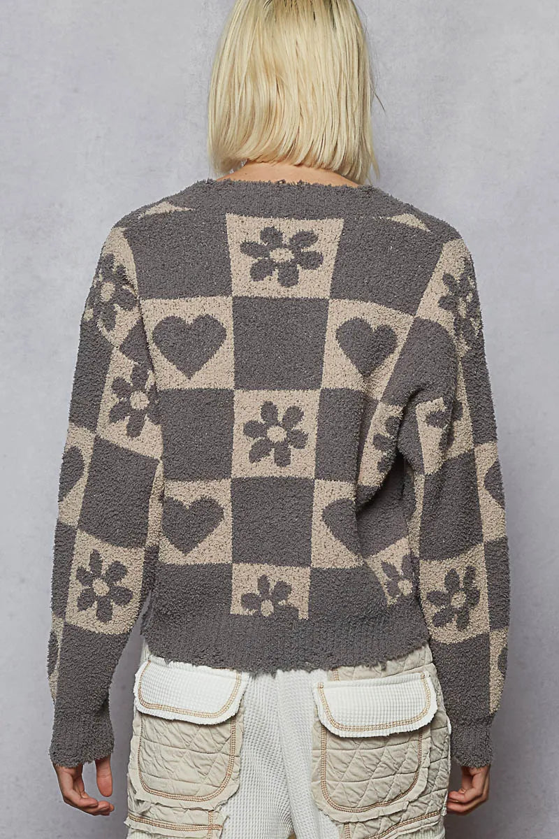 Grey and beige V-neck sweater with a heart pattern and checkered design from Trendsi, featuring a cozy, stylish look.