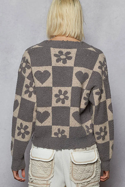 Grey and beige V-neck sweater with a heart pattern and checkered design from Trendsi, featuring a cozy, stylish look.