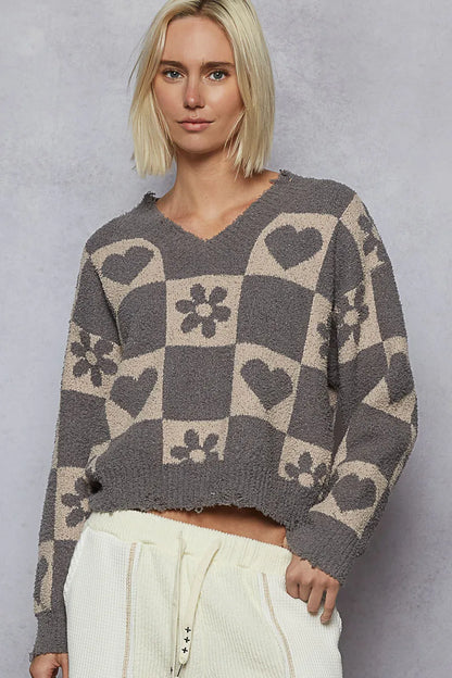 Grey and beige V-neck checkered sweater with heart pattern from Trendsi, featuring a cozy knit design.