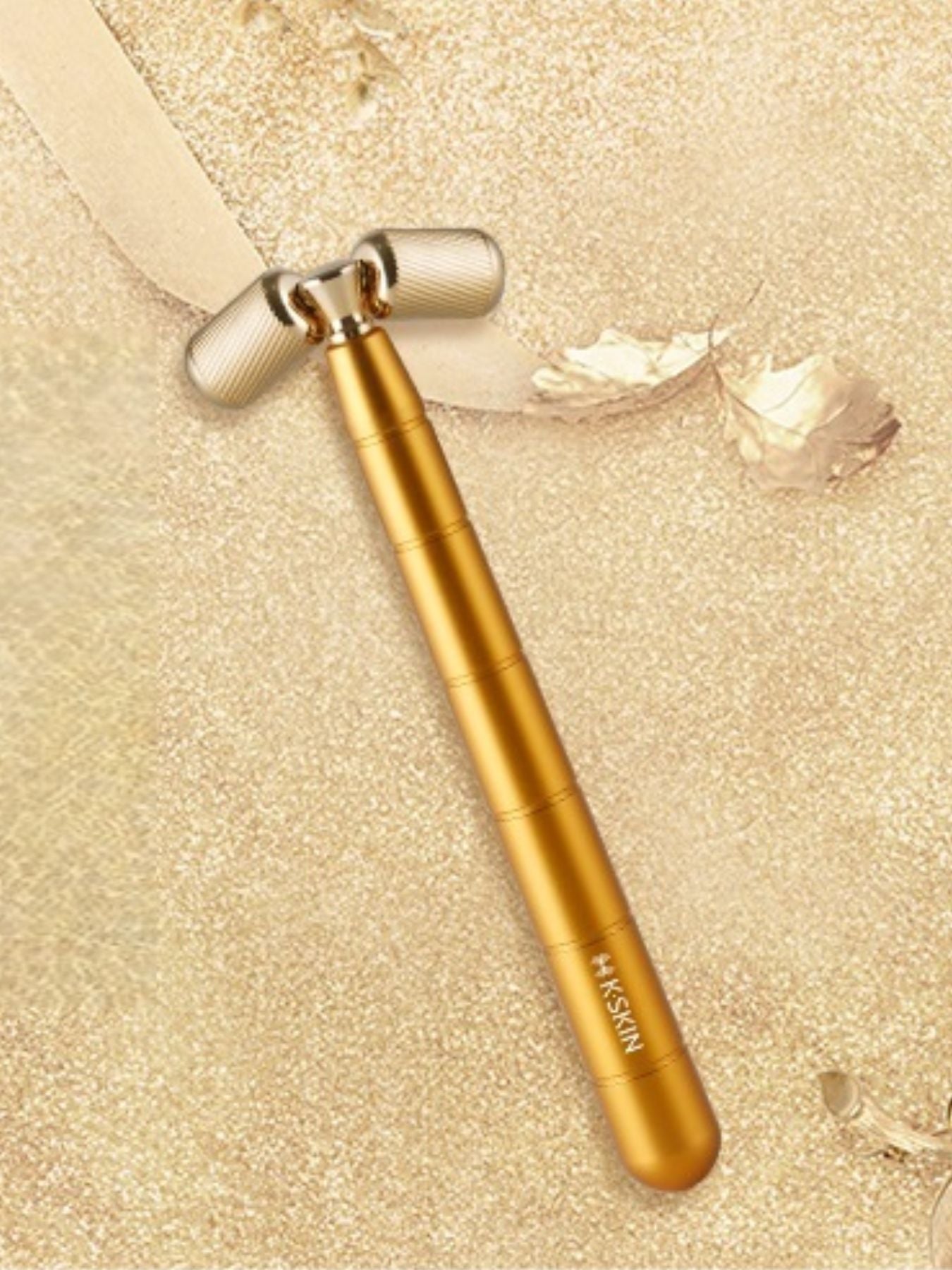 Gold facial massager beauty device by Trendsi, handheld skincare tool for facial massage and skin rejuvenation.
