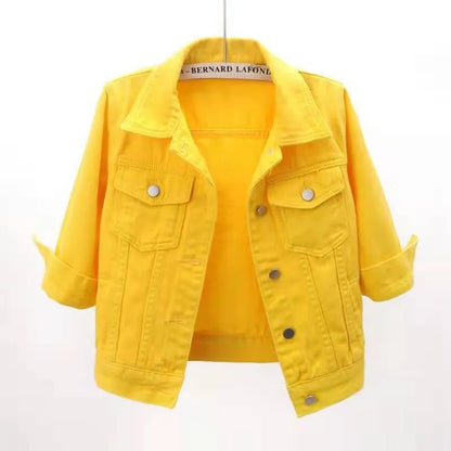 Plus size cropped denim jacket by Trendsi, featuring a classic blue denim look with silver button accents.