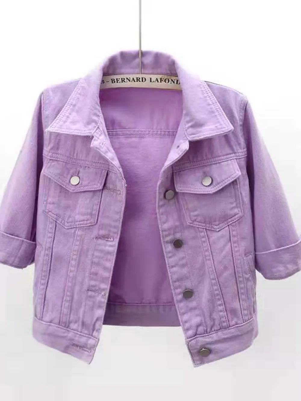 Plus size cropped denim jacket by Trendsi, showing a full-size trendy blue denim jacket with a classic collar and button closure.