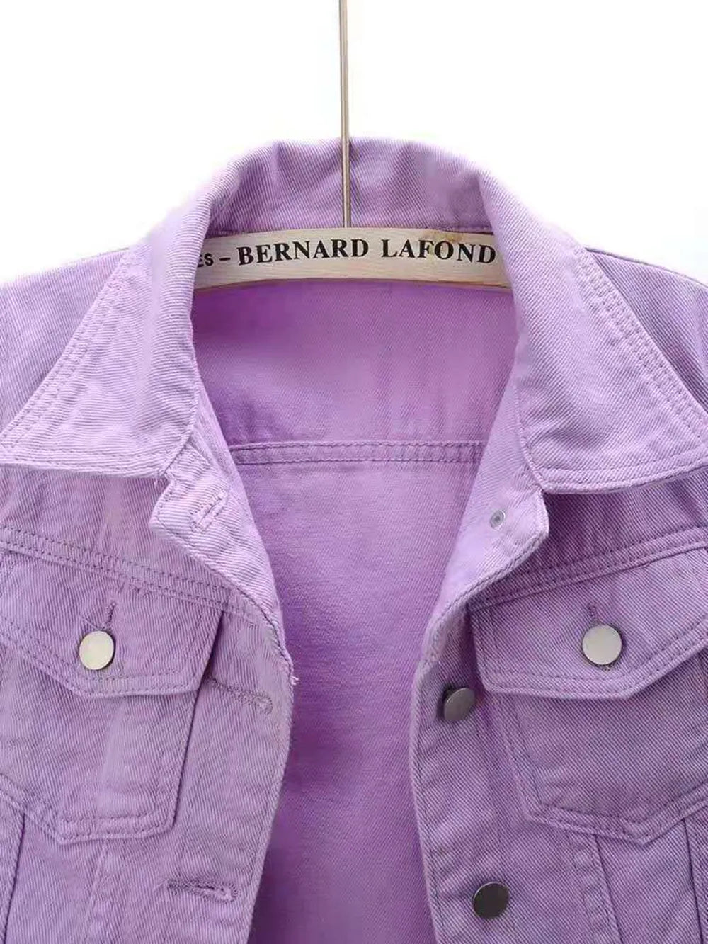 Plus size cropped denim jacket from Trendsi, featuring classic blue denim, button closure, and stylish fit.