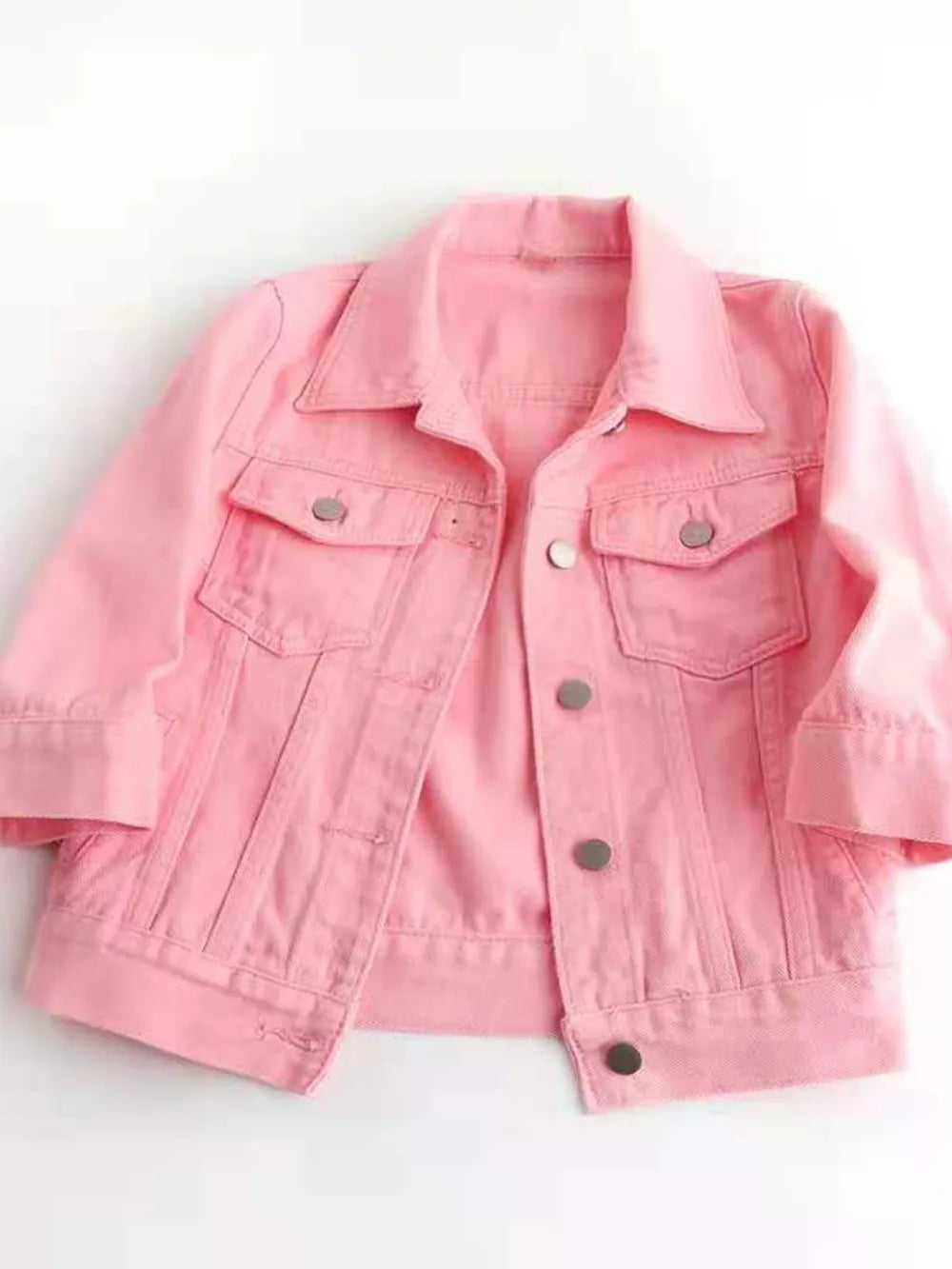Plus size cropped denim jacket by Trendsi, featuring classic blue denim, button-front, and stylish collar detail.
