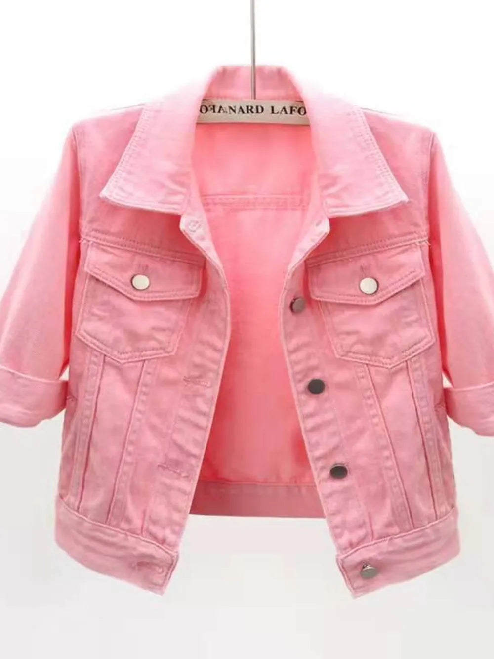 Plus size cropped denim jacket by Trendsi, showing gold-tone buttons and classic blue denim fabric.