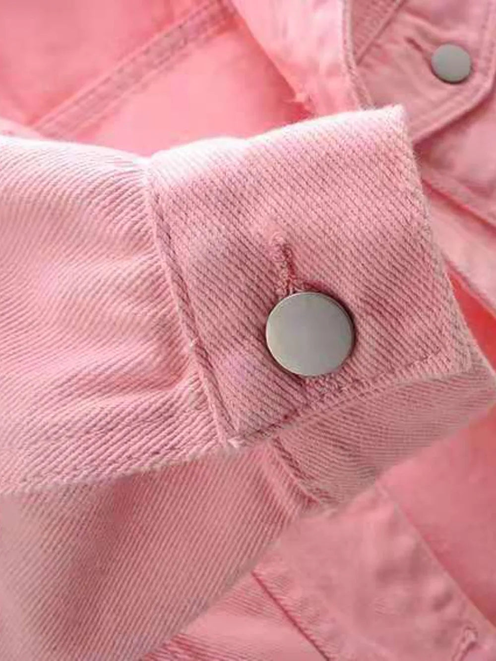 Plus size cropped denim jacket by Trendsi, featuring classic blue denim with silver button details and a stylish, relaxed fit.