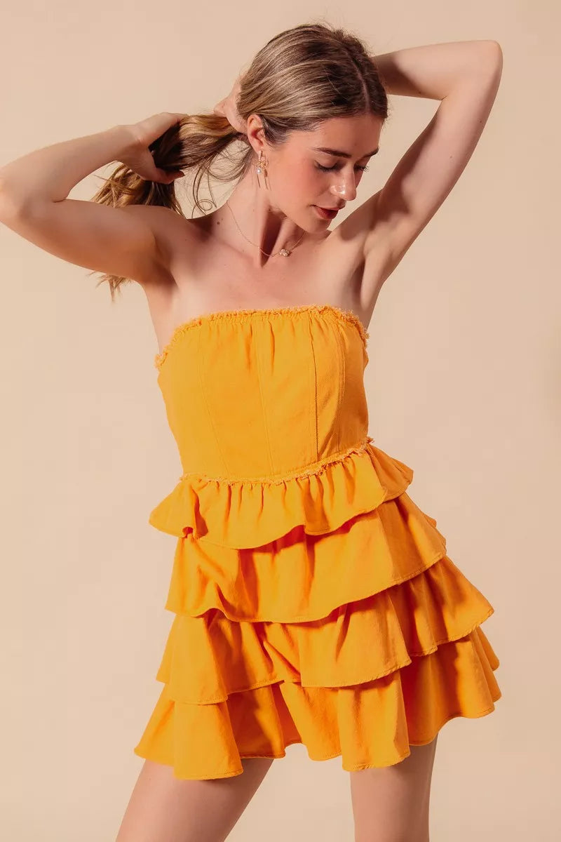 Gold strapless ruffle layered cheer-up dress by Trendsi, featuring a flirty design perfect for game day or casual events.