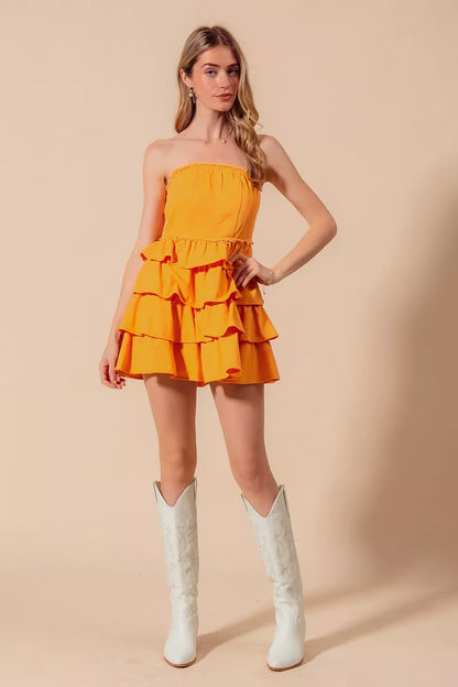Gold strapless ruffle layered cheer-up dress by Trendsi, perfect for game day, featuring a stylish and playful design.