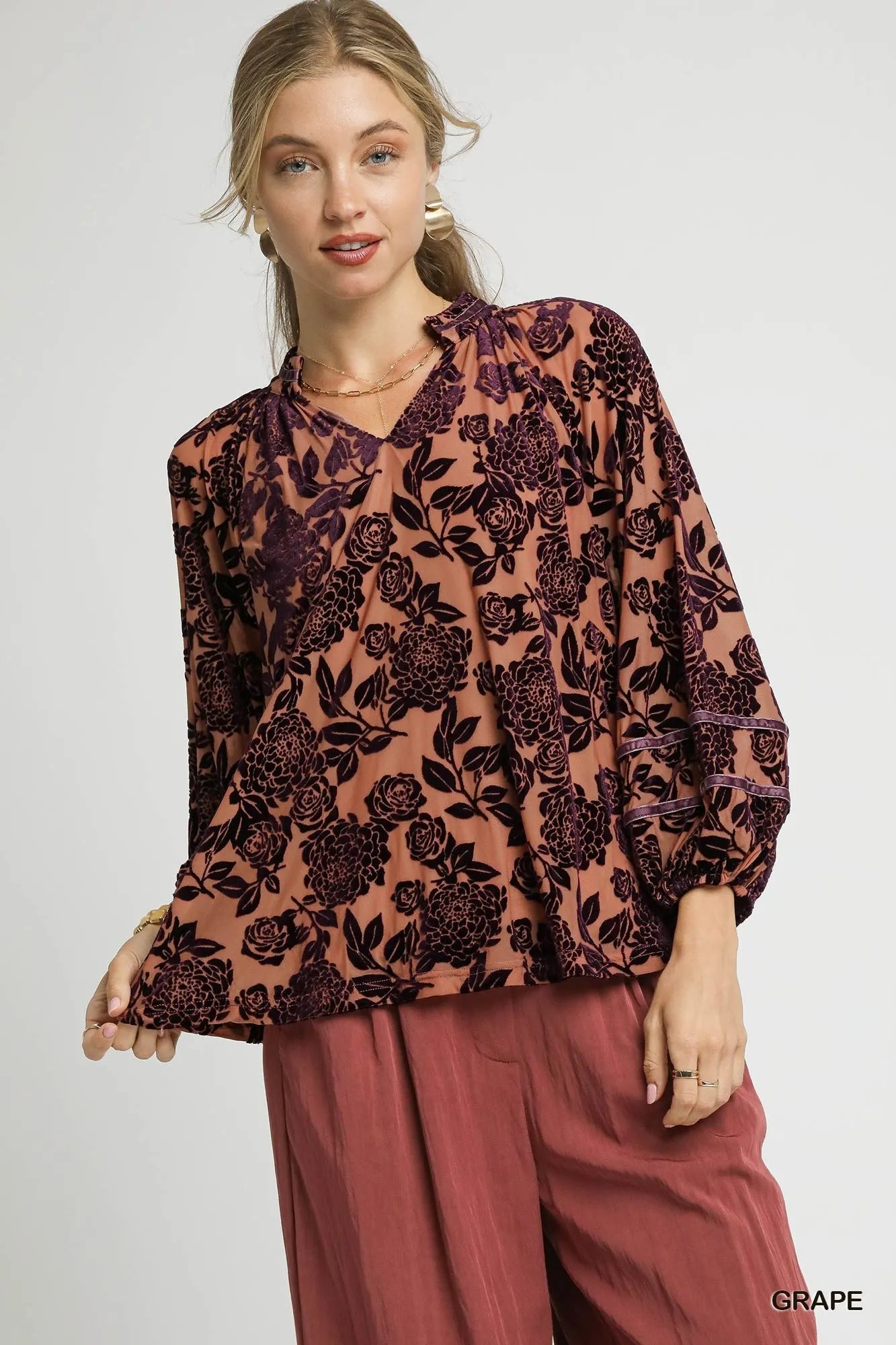 Trendsi Umgee floral velvet blouse with balloon sleeves, showcasing a vibrant floral pattern and elegant, flowy fabric.