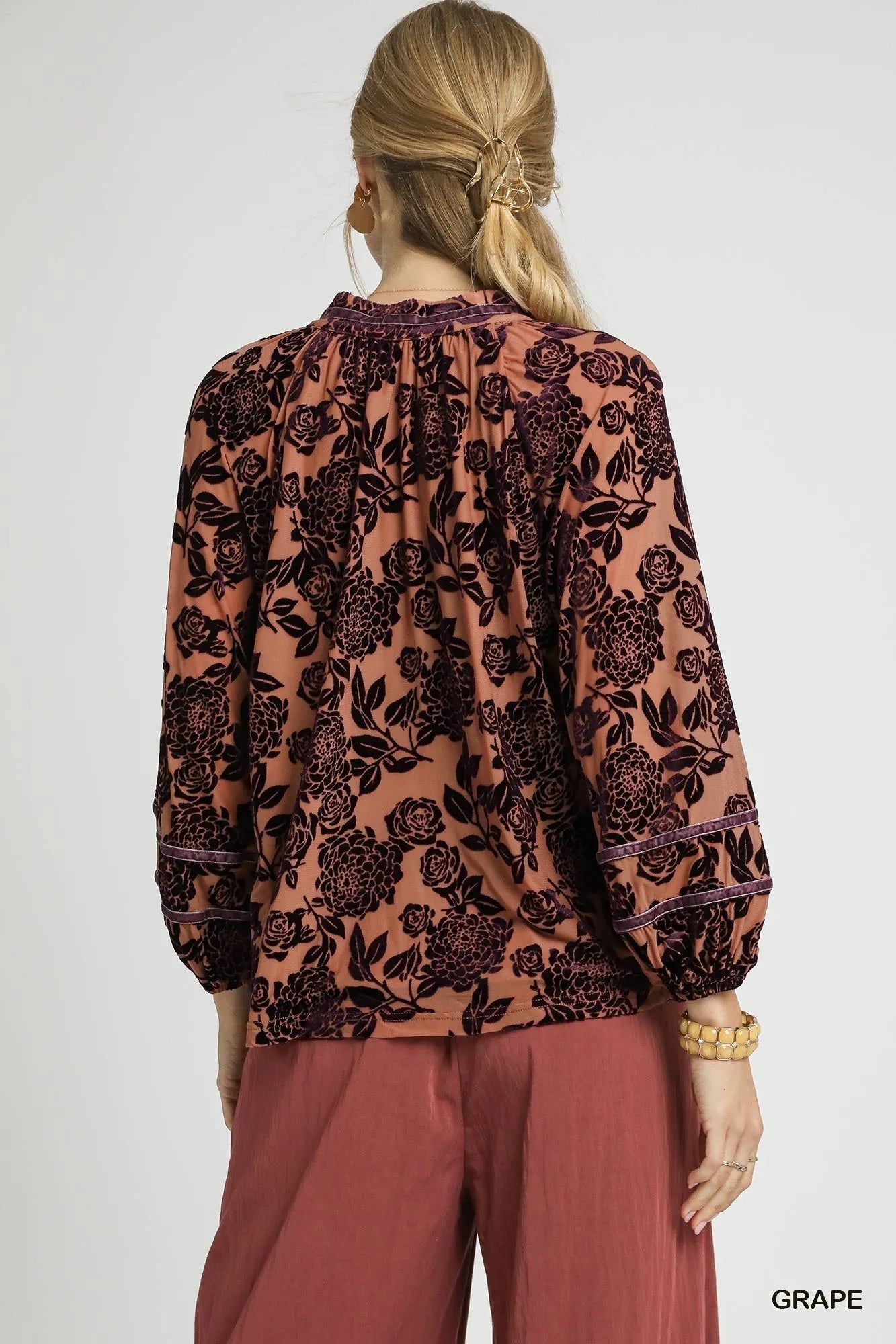 Umgee floral velvet blouse with balloon sleeves, featuring a vibrant floral pattern and soft velvet fabric.