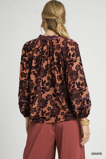 Umgee floral velvet blouse with balloon sleeves, featuring a vibrant floral pattern and soft velvet fabric.