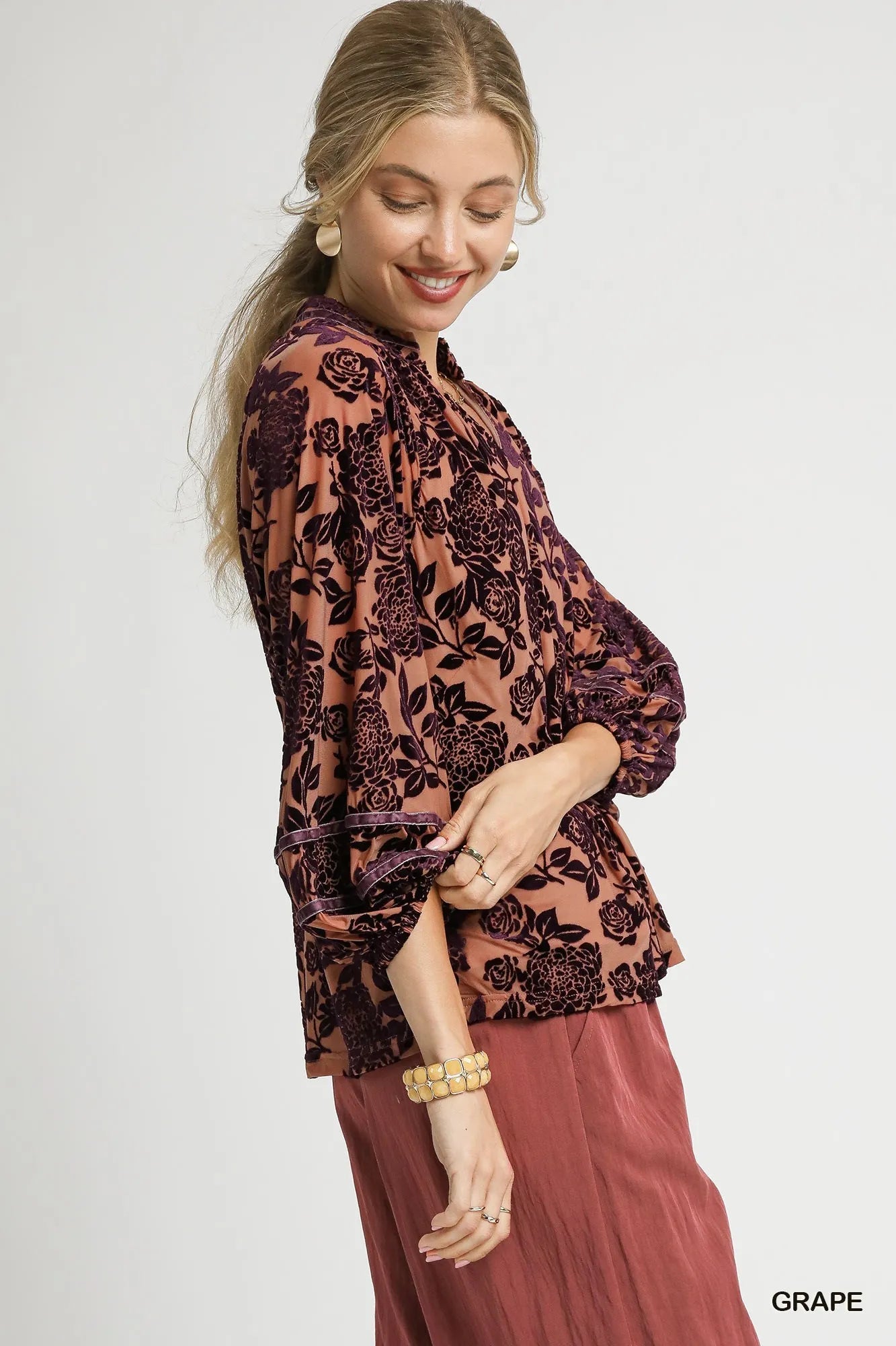 Umgee floral velvet blouse with balloon sleeves, featuring a vibrant floral pattern and soft velvet fabric.