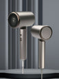 Gray household hair dryer with multiple heat settings and European plug, by Trendsi, designed for versatile hair drying.