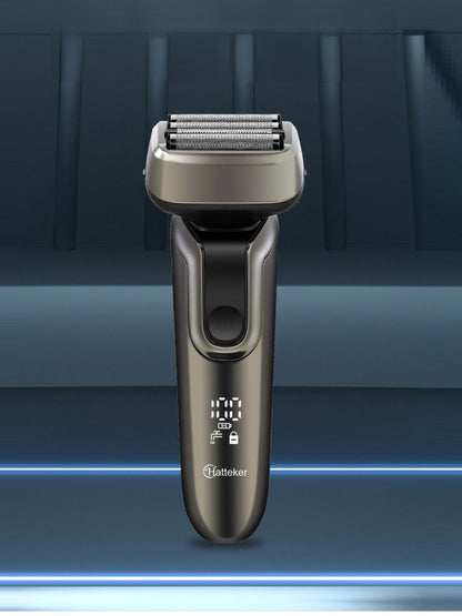 Gray electric shaver with LED display from Trendsi, showing close-up of shaving head and sleek design.
