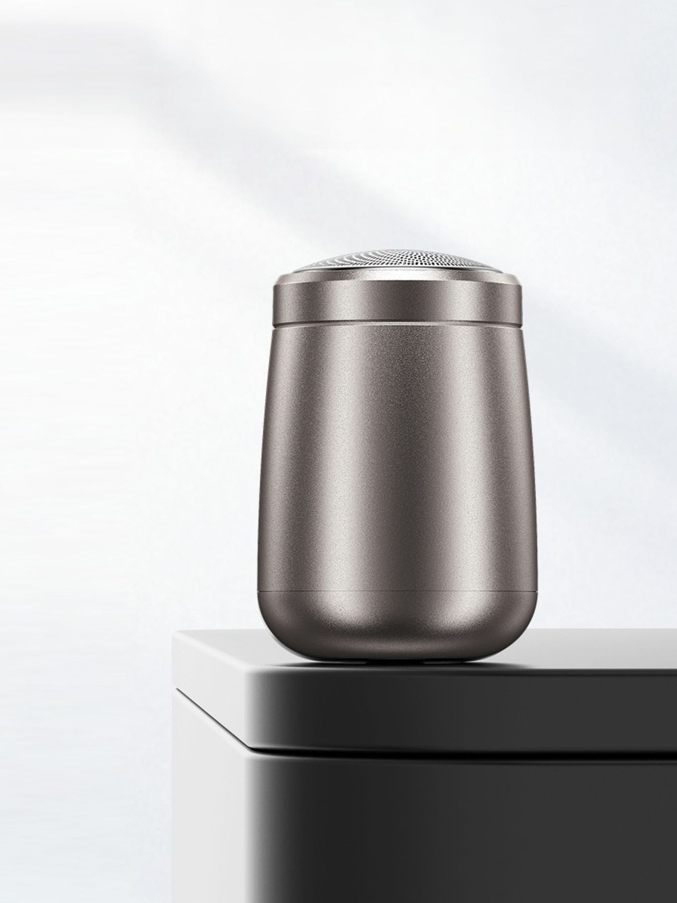 Gray portable mini electric shaver from Trendsi with compact design and one-size-fits-all functionality.
