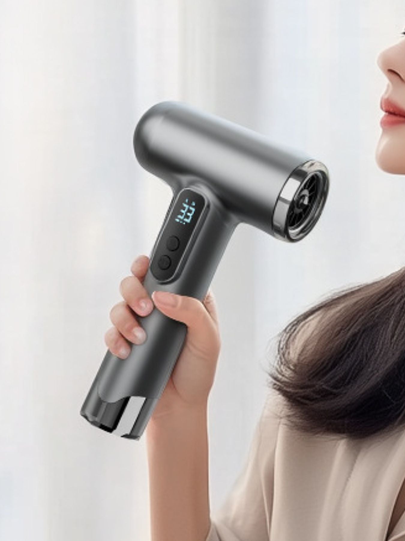 Gray portable rechargeable high-speed hair dryer by Trendsi, compact design with ergonomic handle and advanced drying technology.