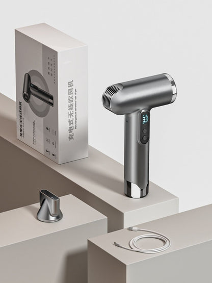 Gray portable rechargeable high-speed hair dryer by Trendsi, compact design with a handle and airflow vents.