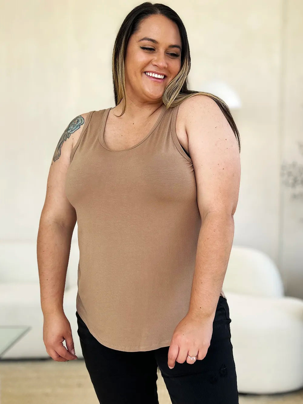 Gray Basic Bae full-size round neck curved hem tank top by Trendsi, front view showing soft fabric and relaxed fit.