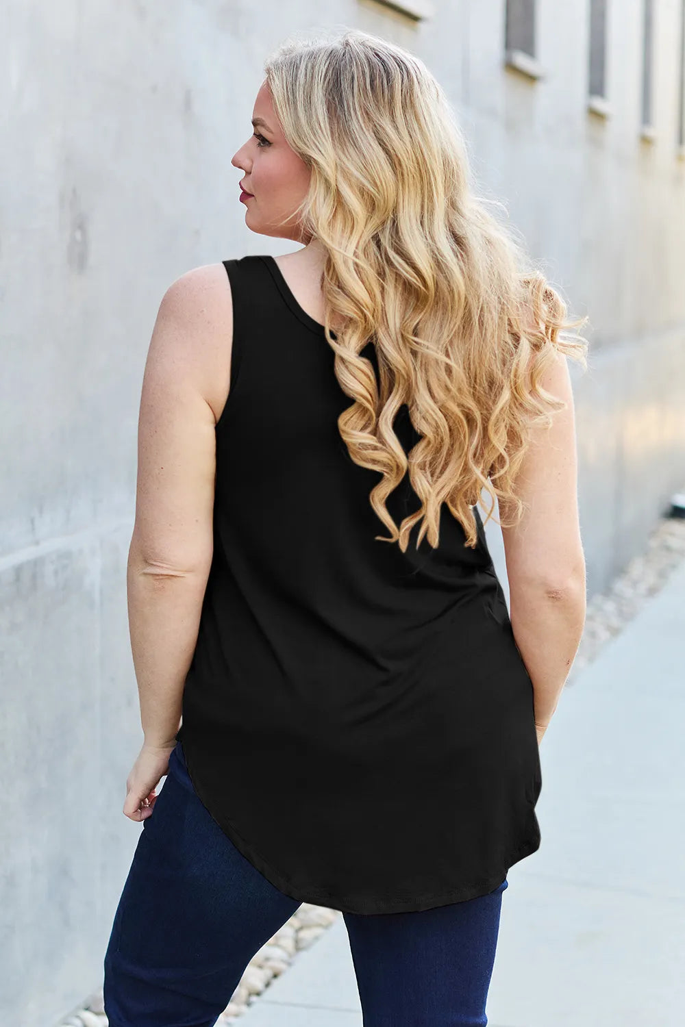 Gray Basic Bae full-size round neck curved hem tank top by Trendsi, displayed flat with relaxed fit and curved hem detail.