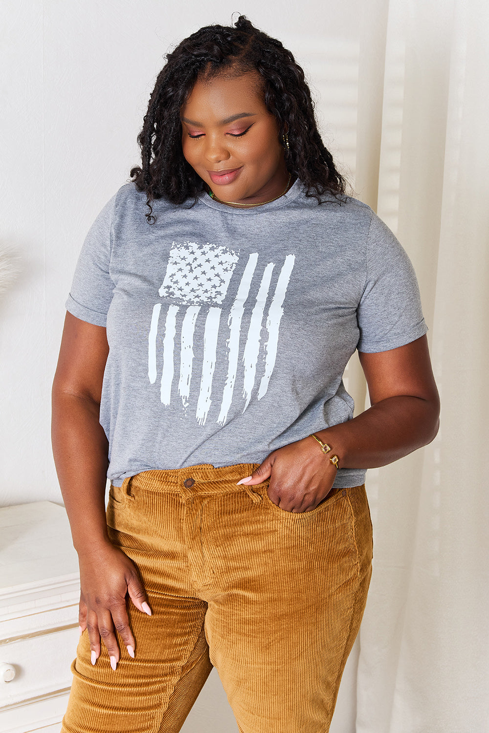 Gray Simply Love US Flag graphic cuffed sleeve T-shirt by Trendsi, featuring patriotic design and casual fit.