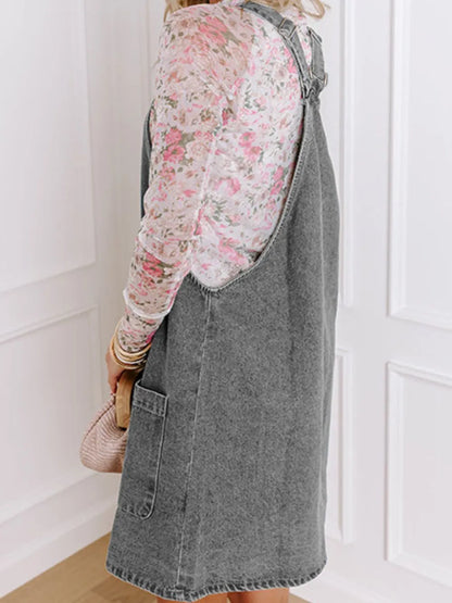 Gray wide strap button-down denim overall dress by Trendsi, featuring adjustable straps and front pockets.