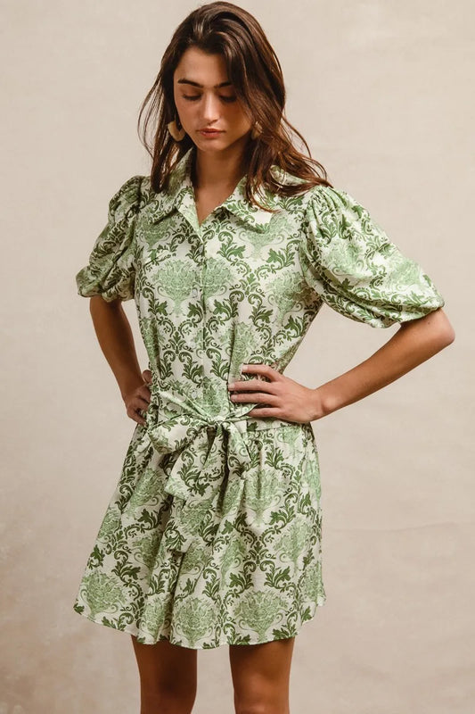 Green and cream floral short sleeve mini shirt dress with tie detail from Trendsi, perfect for casual summer wear.