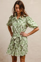 Green and cream floral short sleeve mini shirt dress with tie detail from Trendsi, perfect for casual summer wear.