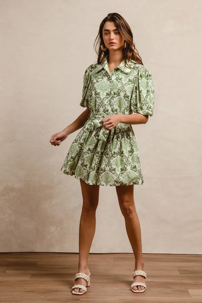 Green and cream floral short sleeve mini shirt dress with a tied waist, by Trendsi, styled with a casual, summery look.