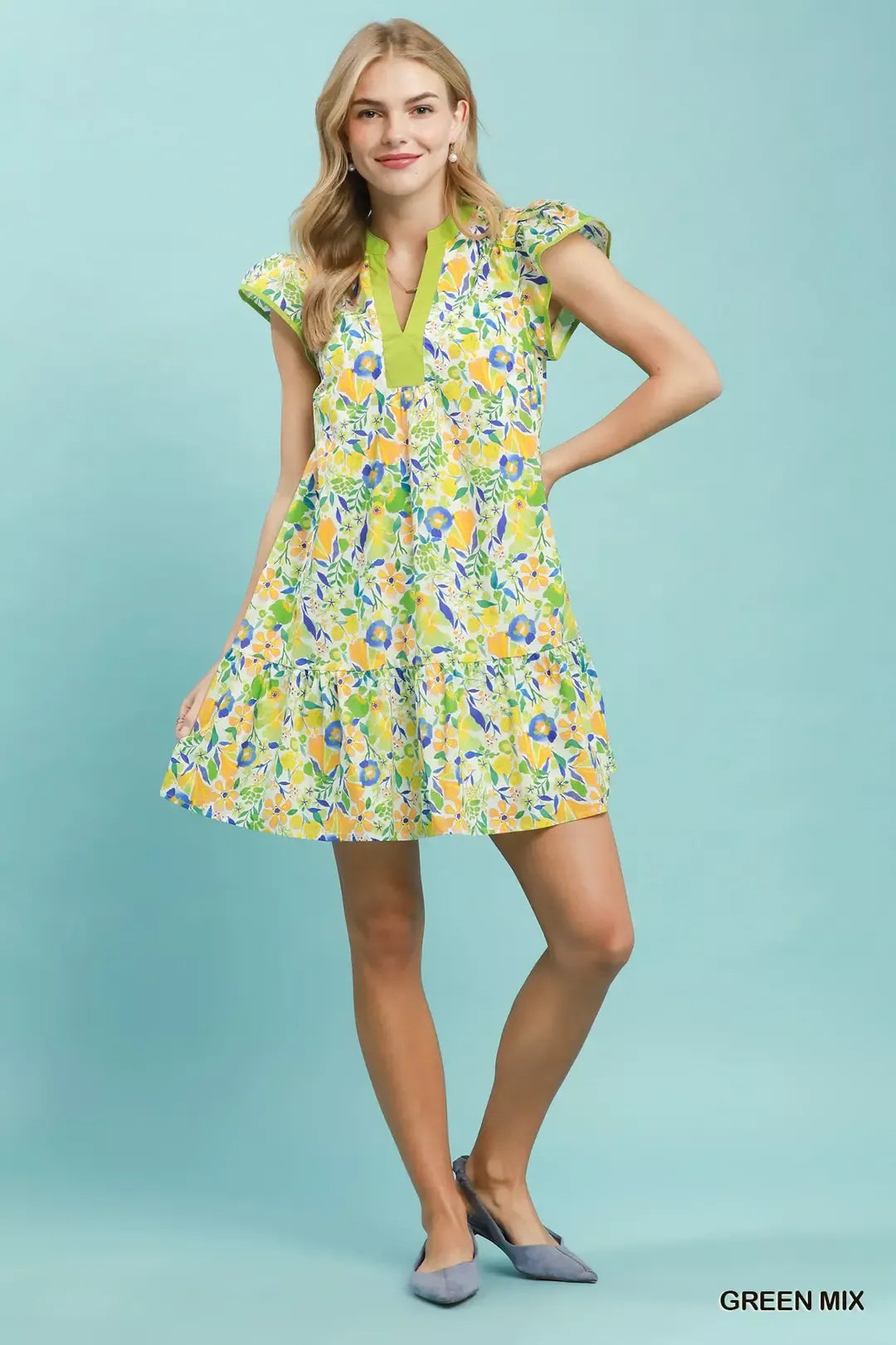 Green floral Umgee tiered mini dress with flutter sleeves, featuring a feminine, layered design perfect for casual or dressy occasions.