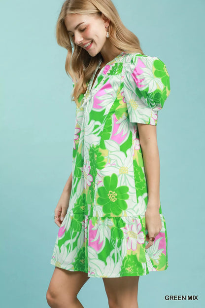 Green floral puff sleeve tiered mini dress by Umgee, featuring a feminine design with layered fabric and a stylish, casual look.