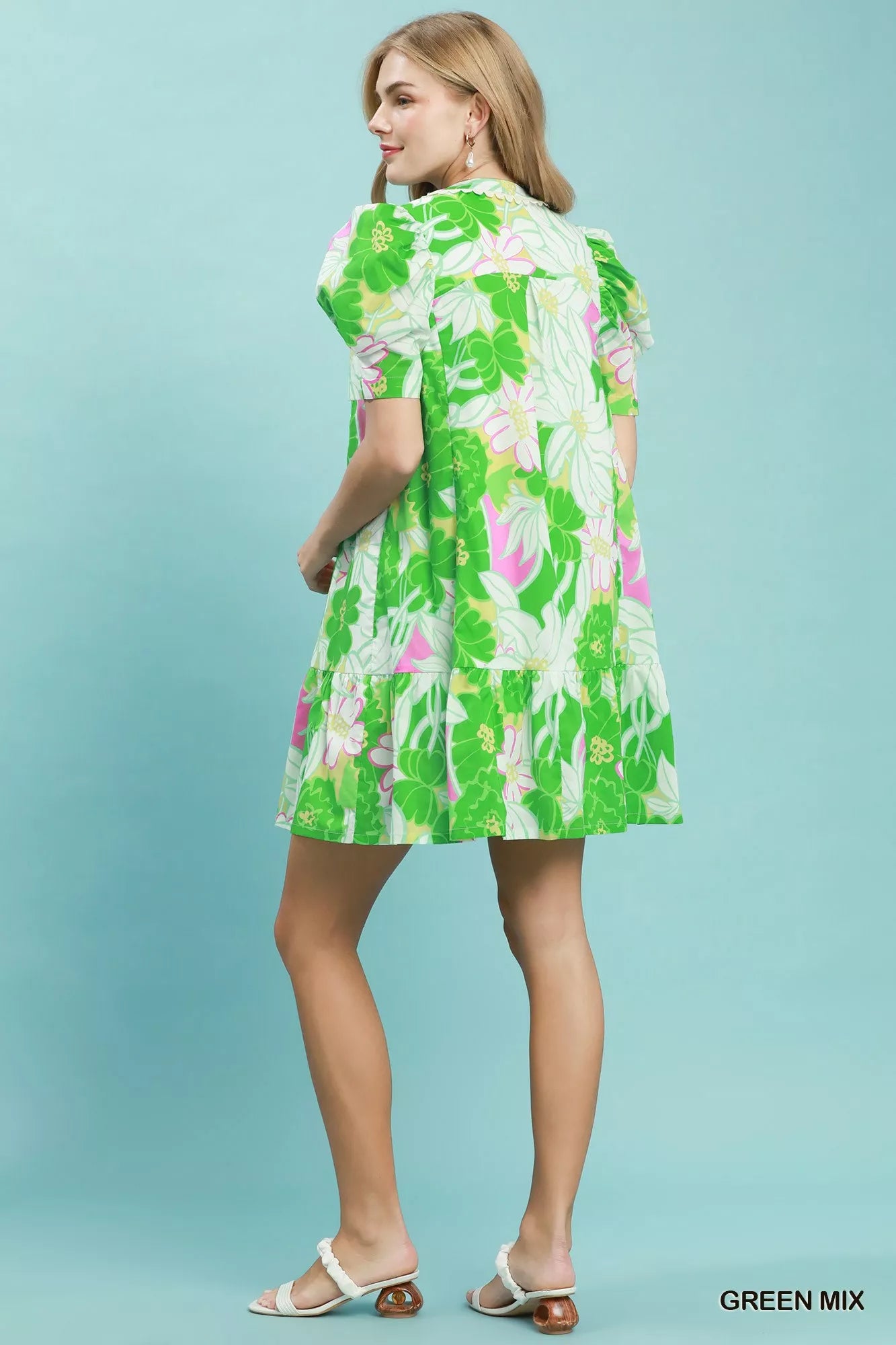 Trendy green floral puff sleeve tiered mini dress by Umgee, featuring a feminine silhouette and lightweight fabric.