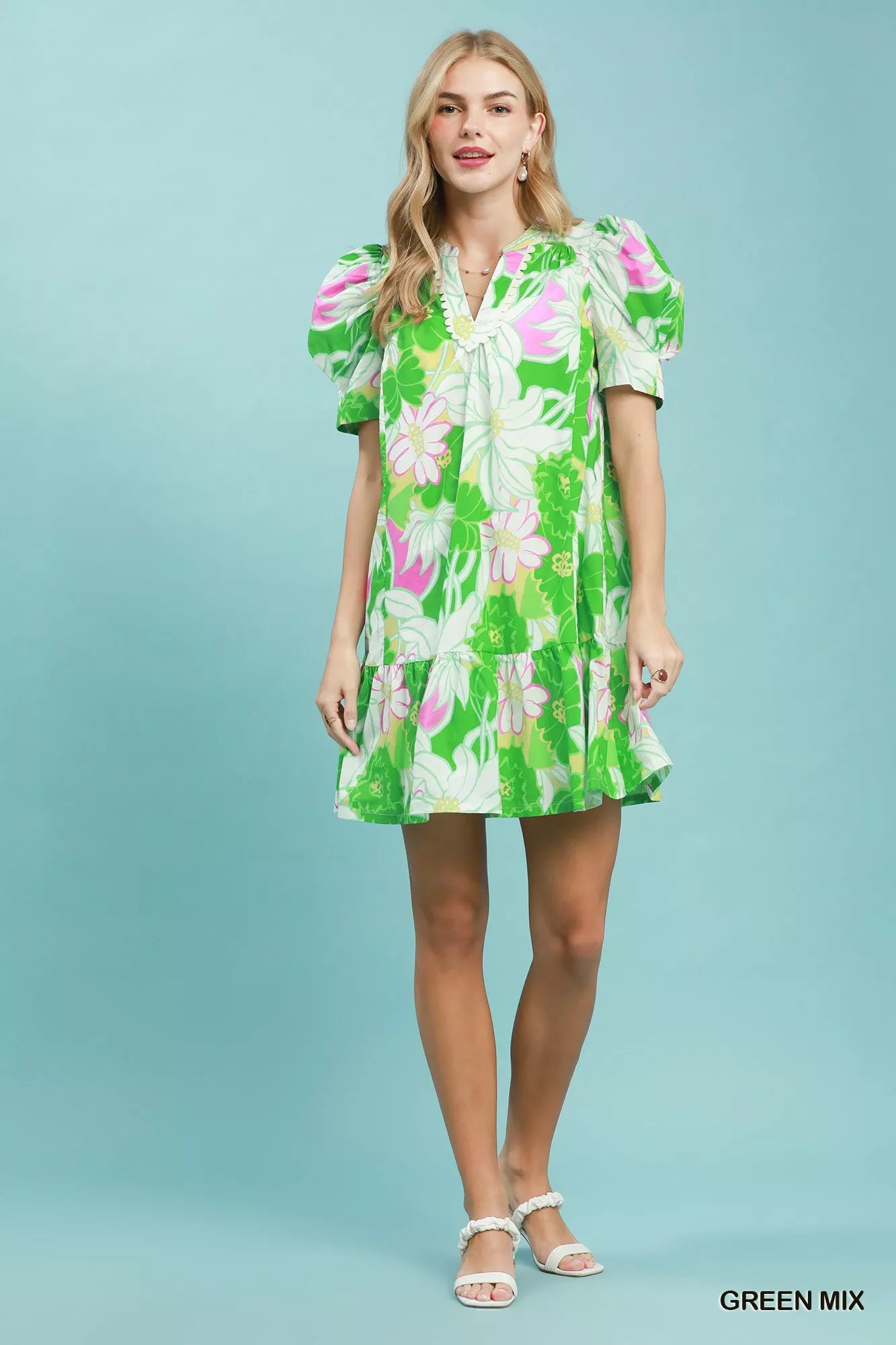 Green floral puff sleeve tiered mini dress by Umgee, featuring a feminine design with ruffled sleeves and a tiered skirt.