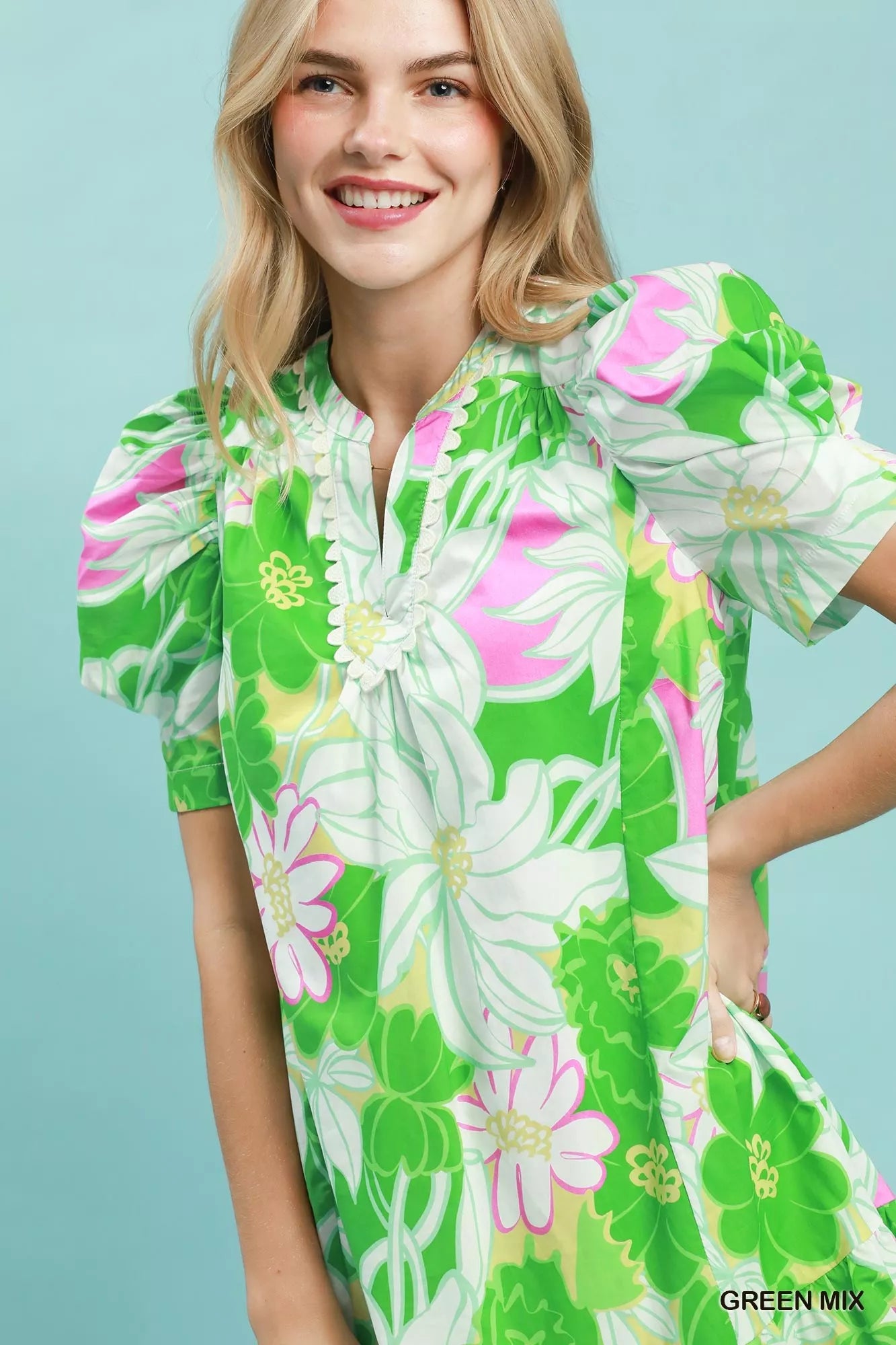 Green floral puff sleeve tiered mini dress by Umgee, featuring a feminine silhouette and tiered skirt, perfect for casual wear.