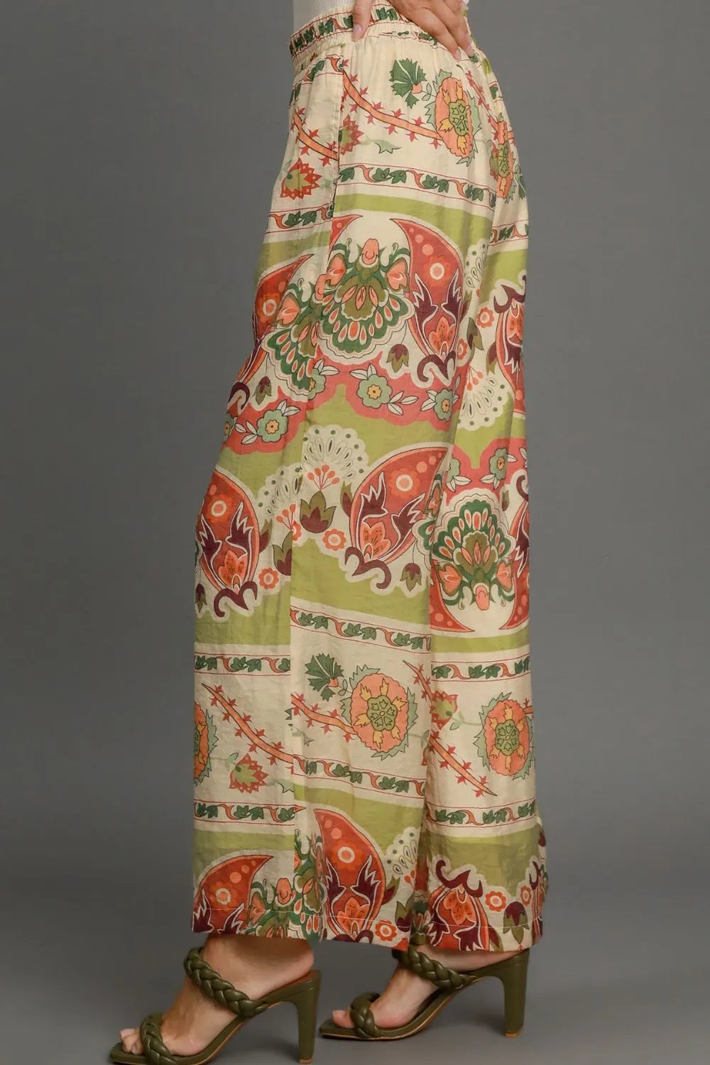 Plus size Umgee wide-leg border print pants in green mix, featuring a relaxed fit and stylish design.