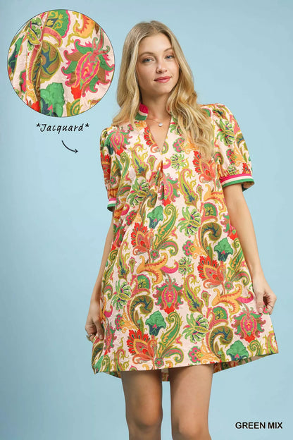 Green and white Umgee Jacquard abstract print mini dress featuring a stylish, fitted design with short sleeves and intricate pattern.