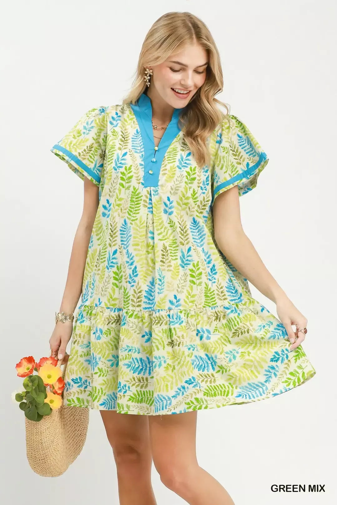 Green leaf print Umgee flutter sleeve tiered mini dress, stylish and lightweight for warm weather occasions.