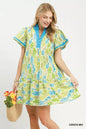 Green leaf print Umgee flutter sleeve tiered mini dress, stylish and lightweight for warm weather occasions.