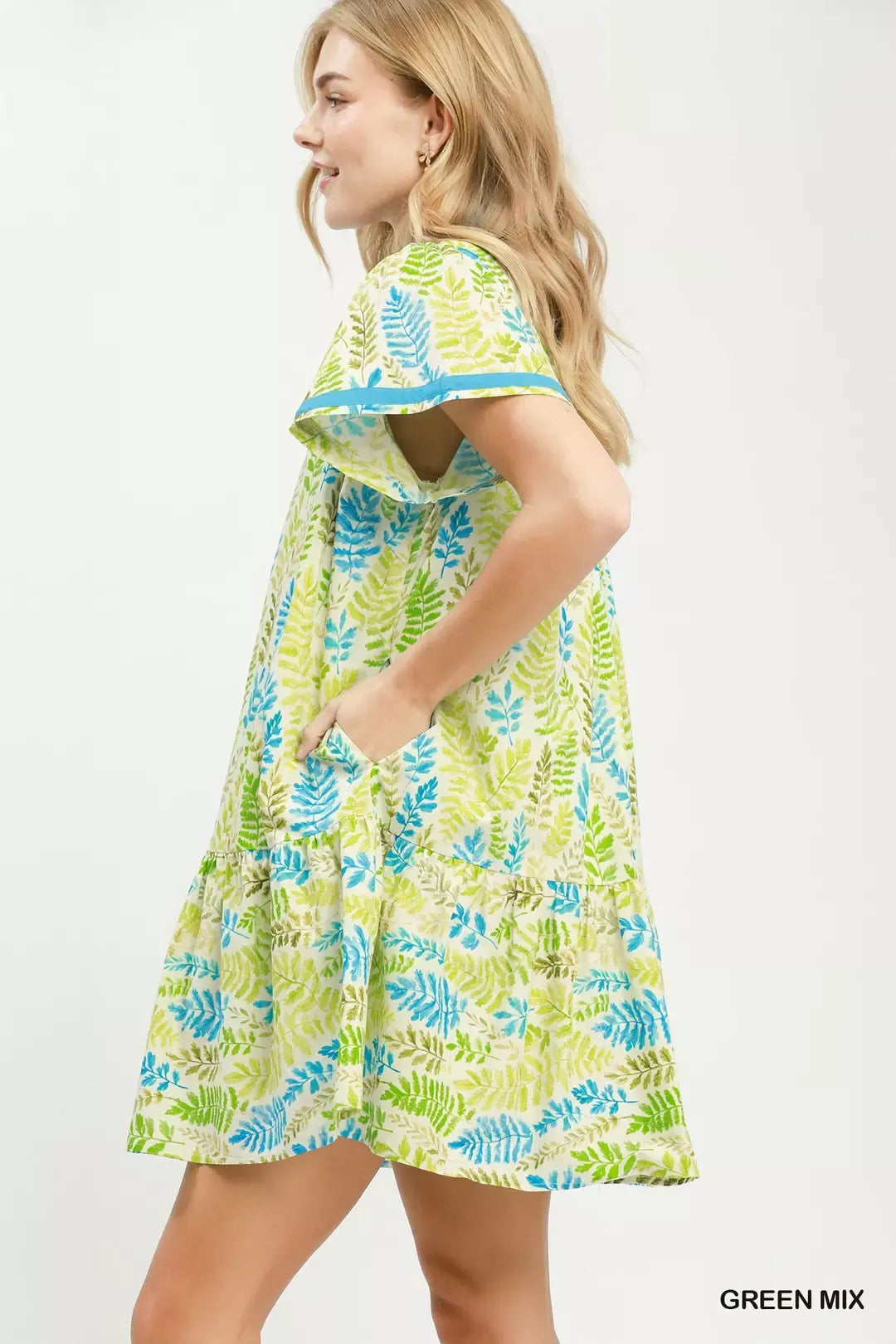 Green leaf print Umgee flutter sleeve tiered mini dress with a relaxed fit and stylish tiered design.