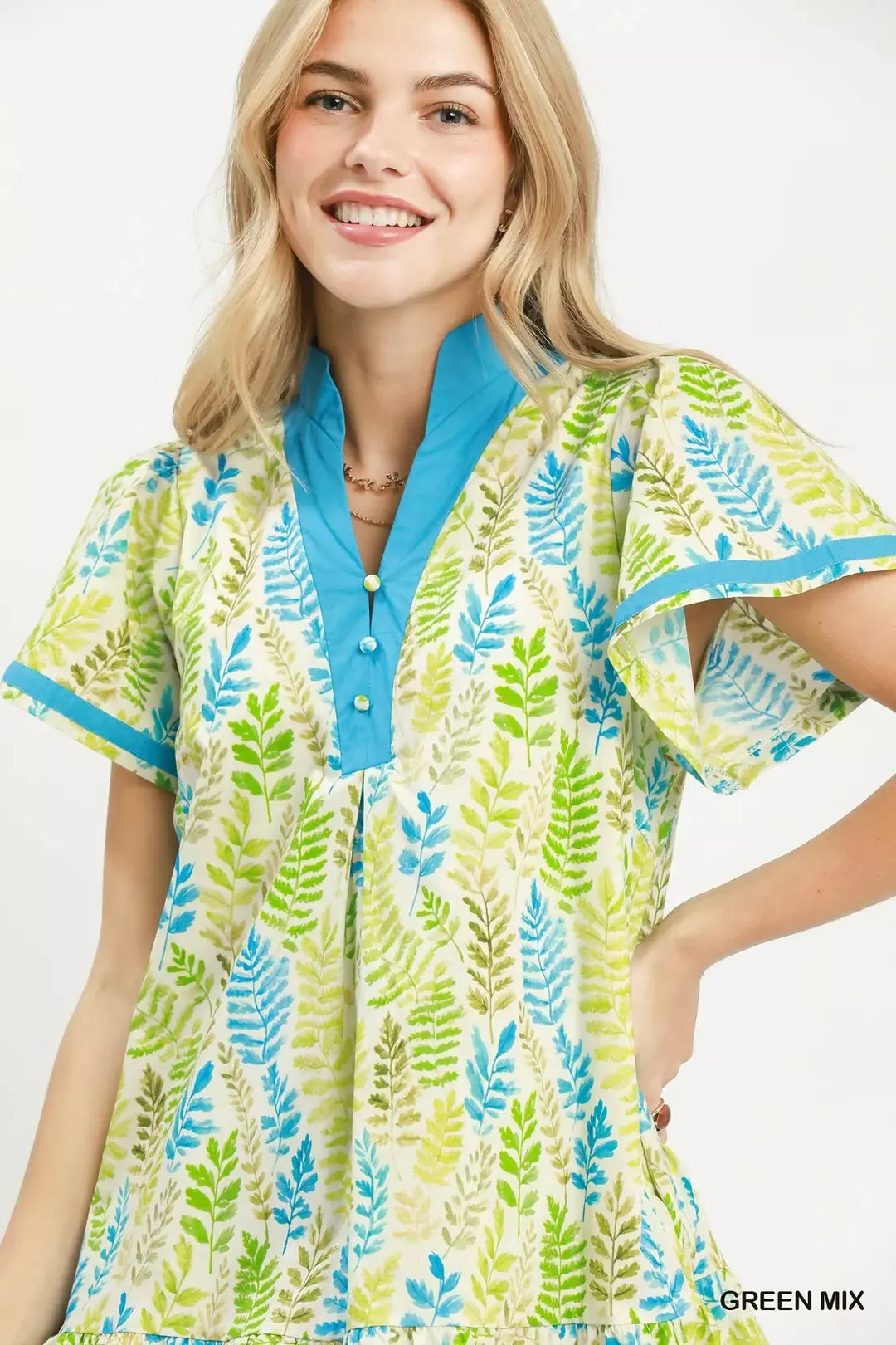 Green leaf print Umgee flutter sleeve tiered mini dress with a relaxed fit, perfect for casual or summer wear.