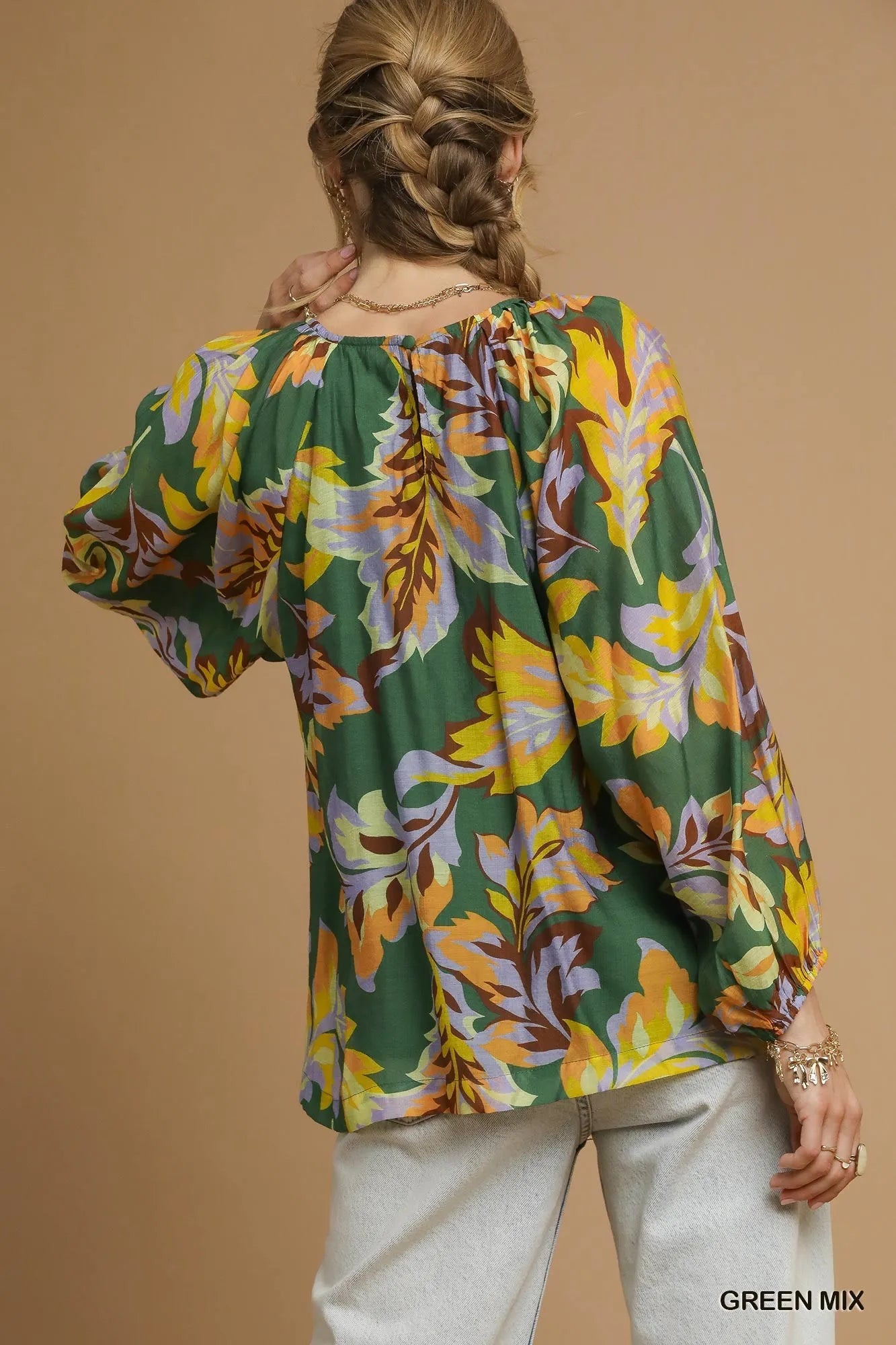 Green Umgee abstract print balloon sleeve blouse with relaxed fit and stylish design, perfect for casual or dressy occasions.