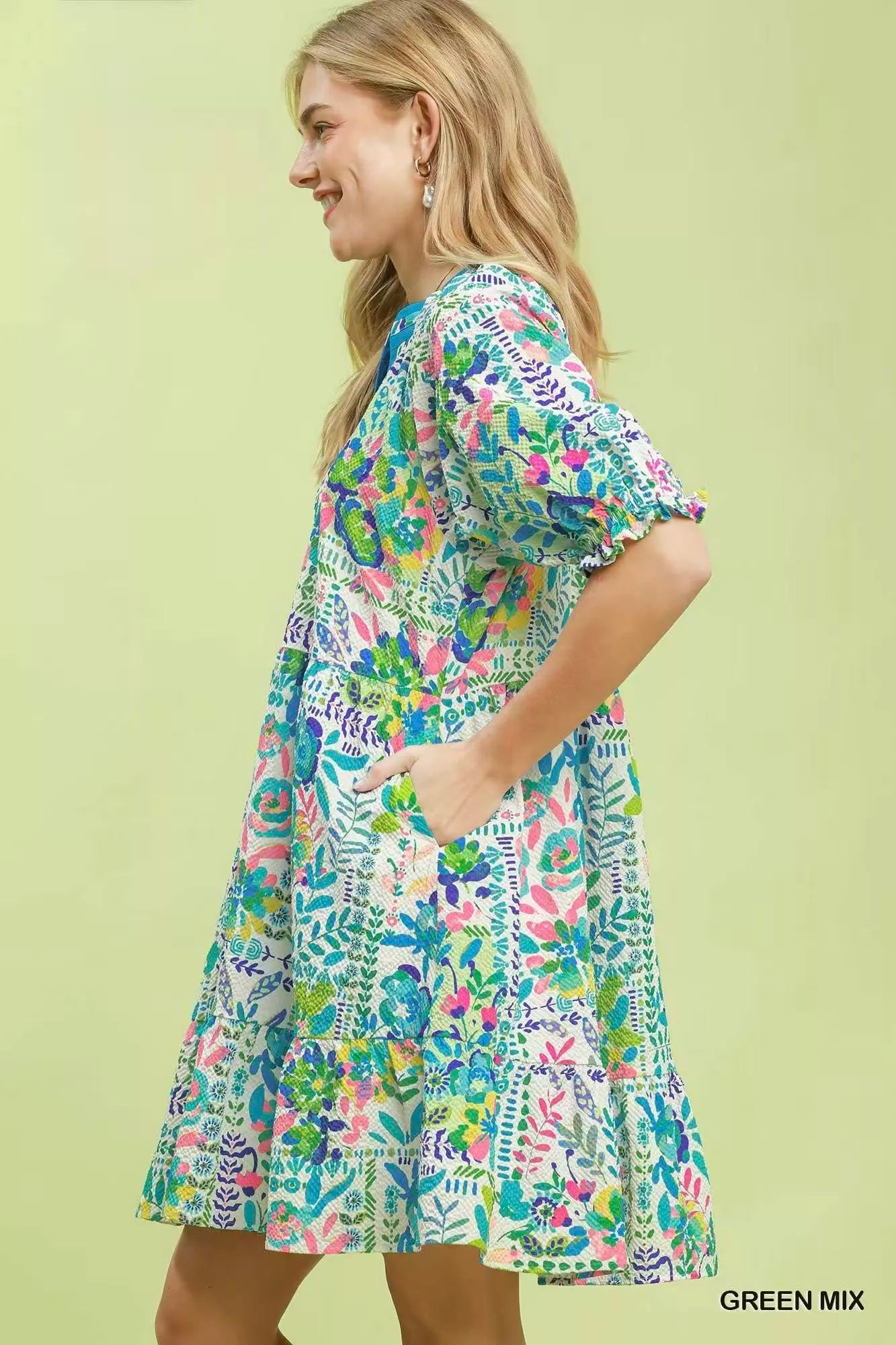 Green botanical print puff sleeve tiered dress by Umgee featuring a flowy silhouette and tiered design.