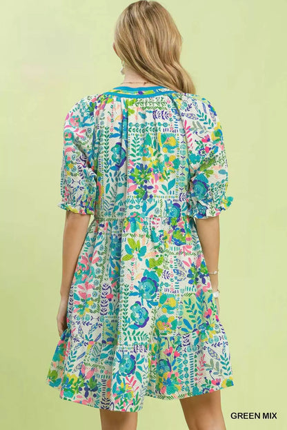 Green Umgee Mix botanical print puff sleeve tiered dress with floral pattern and ruffled details, perfect for spring and summer.