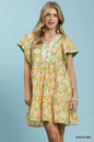 Green floral tiered mini dress by Umgee with side pockets, featuring a breezy, feminine design and lightweight fabric.
