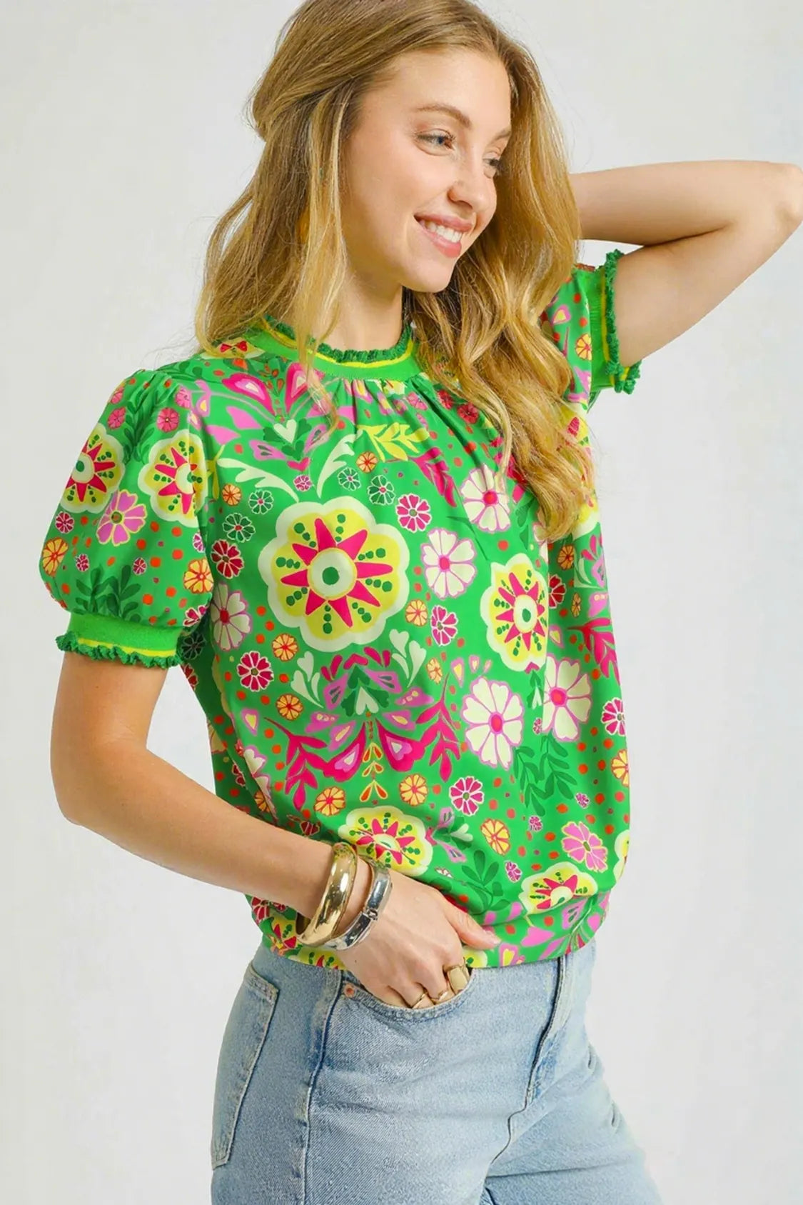 Green floral puff sleeve top by Umgee featuring a retro style and fitted silhouette, perfect for casual or stylish wear.