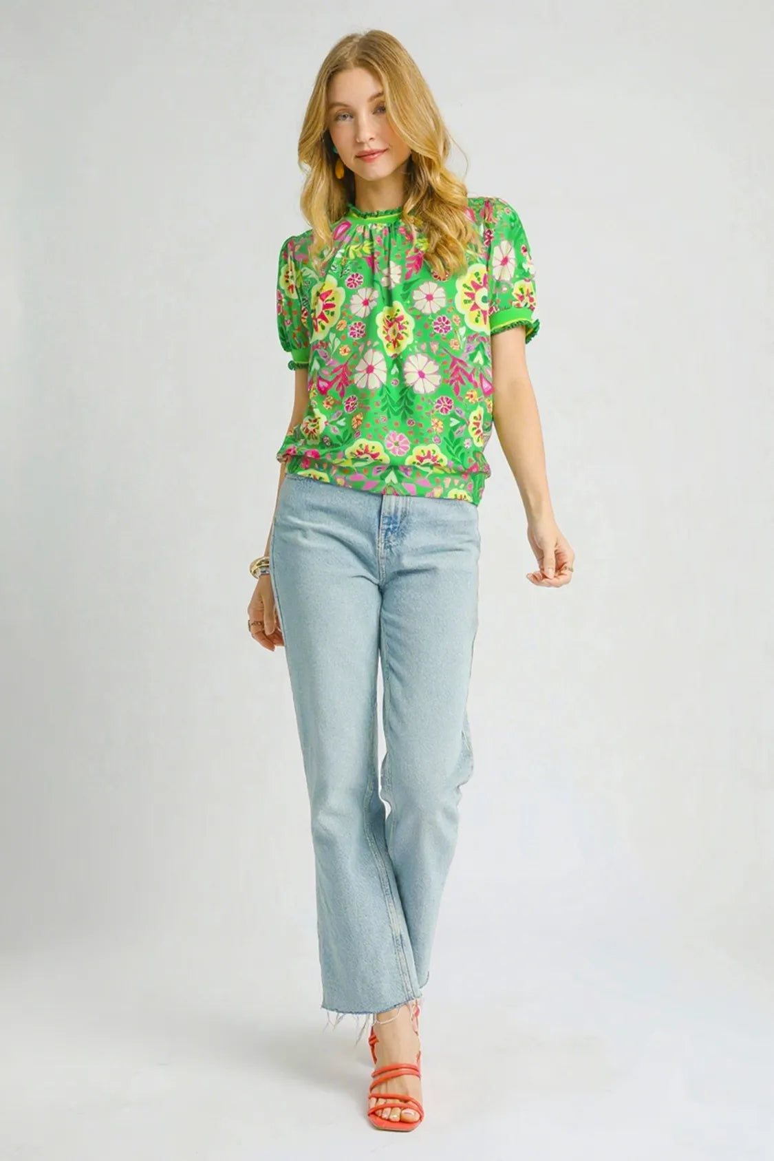 Green floral puff sleeve top from Umgee featuring retro style and ruffled sleeves, perfect for casual or stylish looks.